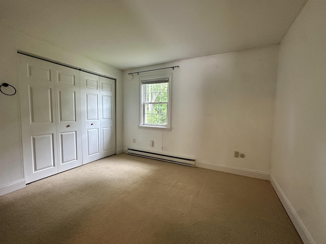 87 Cricketbrook Rd Unit 87, Dover, NH 03820 - unfurnished bedroom with a baseboard heating unit, carpet floors, and a closet