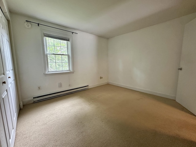 87 Cricketbrook Rd Unit 87, Dover, NH 03820 - unfurnished room featuring a baseboard heating unit and light colored carpet