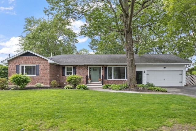 11 Bond St, Hudson, NH 03051 - ranch-style house with brick siding, an attached garage, asphalt driveway, a front lawn, and roof with shingles