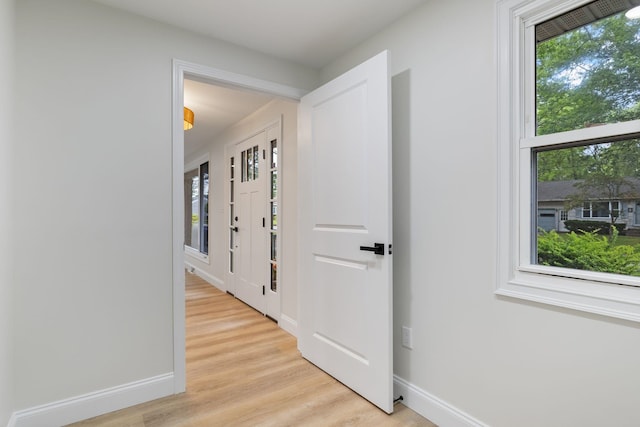 11 Bond St, Hudson, NH 03051 - hall featuring light wood-type flooring and baseboards