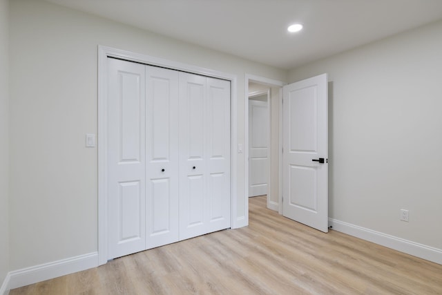 11 Bond St, Hudson, NH 03051 - unfurnished bedroom featuring light wood-style flooring, recessed lighting, and a closet
