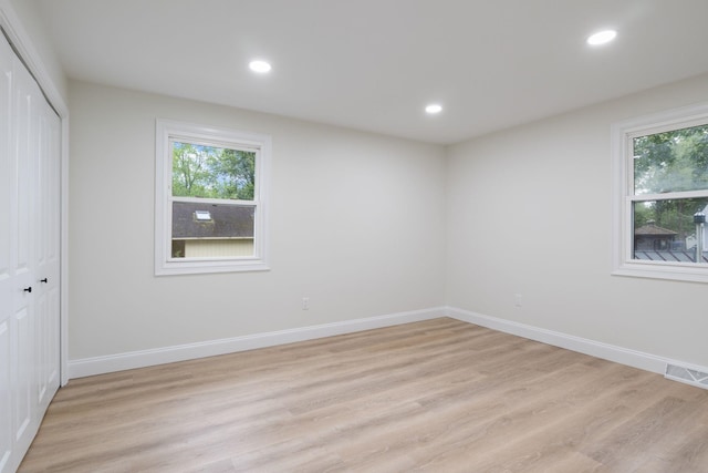 11 Bond St, Hudson, NH 03051 - unfurnished bedroom featuring light wood-style flooring, a closet, and recessed lighting