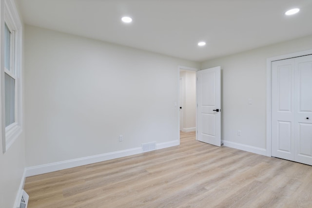 11 Bond St, Hudson, NH 03051 - unfurnished bedroom with light wood-style flooring, recessed lighting, and a closet
