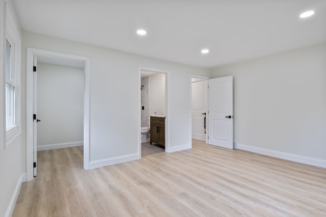 11 Bond St, Hudson, NH 03051 - unfurnished bedroom featuring light wood-style flooring, a spacious closet, recessed lighting, ensuite bathroom, and a closet