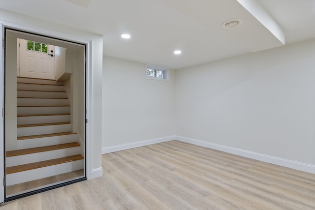 11 Bond St, Hudson, NH 03051 - below grade area featuring wood finished floors, recessed lighting, and stairs