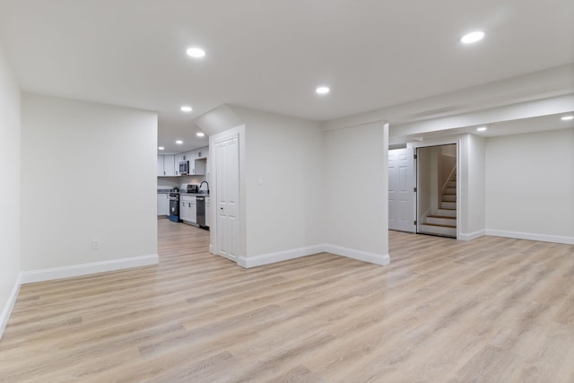 11 Bond St, Hudson, NH 03051 - finished below grade area featuring stairs, recessed lighting, and light wood-style flooring