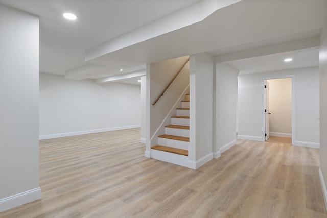 11 Bond St, Hudson, NH 03051 - finished basement with light wood-style floors, recessed lighting, and stairway