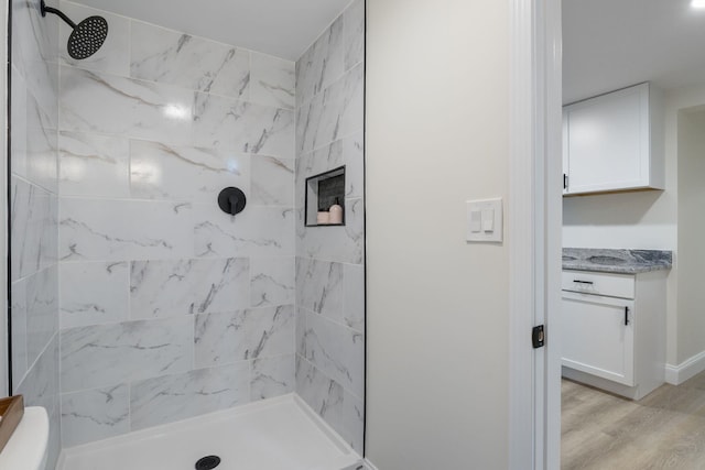 11 Bond St, Hudson, NH 03051 - full bathroom with a tile shower, wood finished floors, and vanity