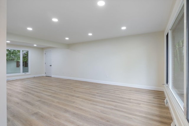 11 Bond St, Hudson, NH 03051 - empty room with light wood-style flooring and recessed lighting