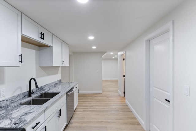 11 Bond St, Hudson, NH 03051 - kitchen featuring stainless steel dishwasher, recessed lighting, light wood-type flooring, white cabinetry, and light stone countertops
