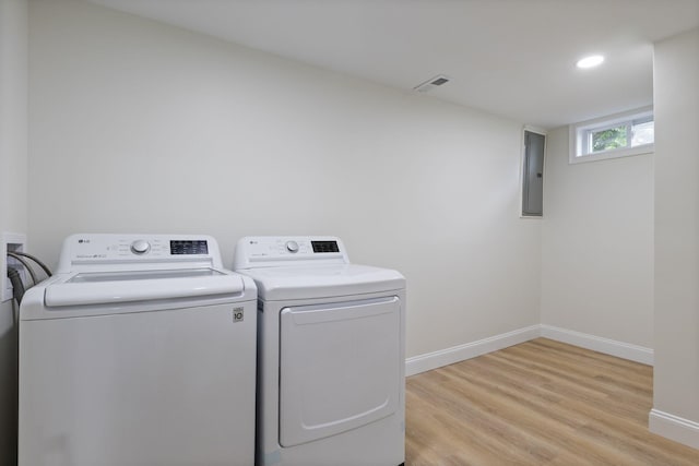 11 Bond St, Hudson, NH 03051 - washroom featuring separate washer and dryer, light wood-type flooring, electric panel, and recessed lighting