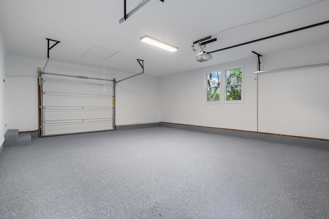 11 Bond St, Hudson, NH 03051 - garage featuring a garage door opener and baseboards
