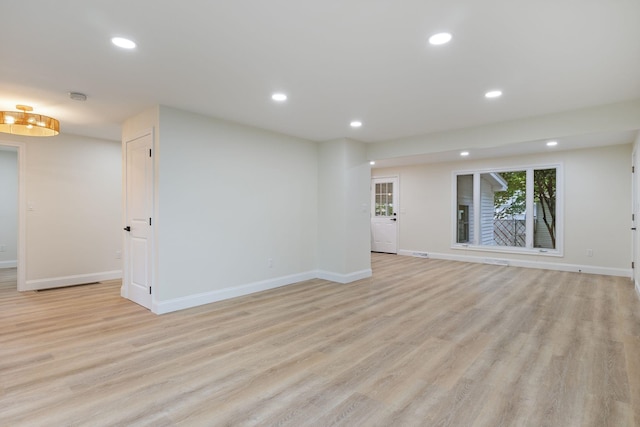 11 Bond St, Hudson, NH 03051 - unfurnished living room with light wood-style floors and recessed lighting