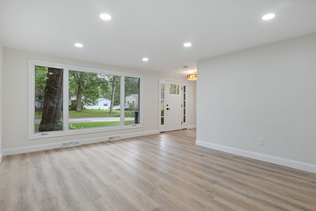11 Bond St, Hudson, NH 03051 - unfurnished living room with light wood finished floors and recessed lighting