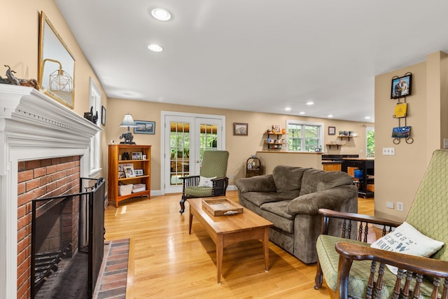 9 Strout Ln, Durham, NH 03824 - living room with a fireplace, light wood finished floors, plenty of natural light, and recessed lighting