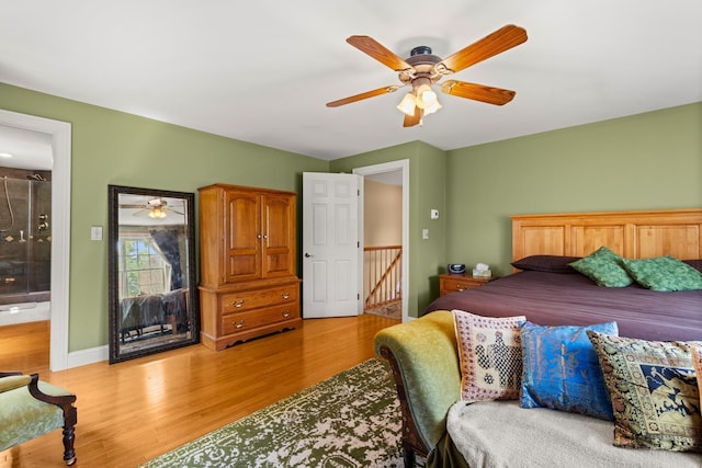 9 Strout Ln, Durham, NH 03824 - bedroom with light wood-type flooring, ceiling fan, and ensuite bath