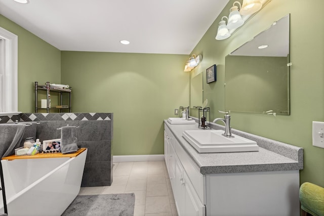 9 Strout Ln, Durham, NH 03824 - full bath with a freestanding tub, double vanity, tile patterned floors, and recessed lighting