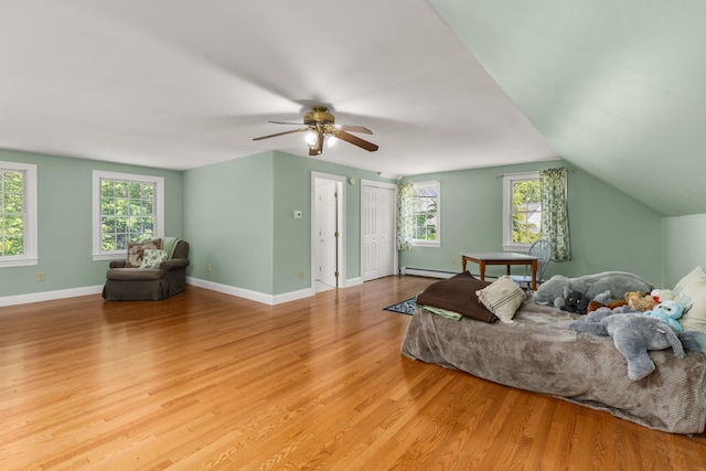 9 Strout Ln, Durham, NH 03824 - bedroom with light wood-style flooring, multiple windows, a baseboard radiator, and ceiling fan