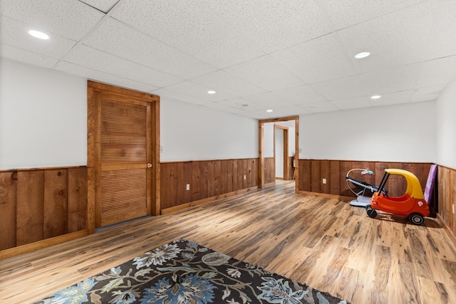 9 Strout Ln, Durham, NH 03824 - living area with wainscoting, wood finished floors, wooden walls, and a paneled ceiling