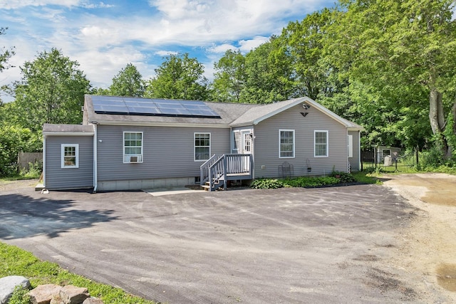265 Lowell St, Rochester, NH 03867 - manufactured / mobile home featuring solar panels and a shingled roof