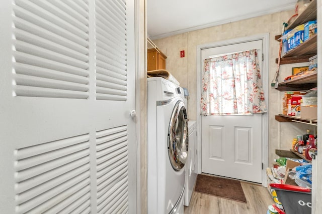265 Lowell St, Rochester, NH 03867 - laundry area with cabinet space, washing machine and clothes dryer, and light wood finished floors