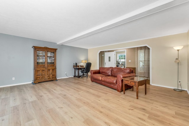 265 Lowell St, Rochester, NH 03867 - living room with light wood-type flooring, a desk, and beam ceiling