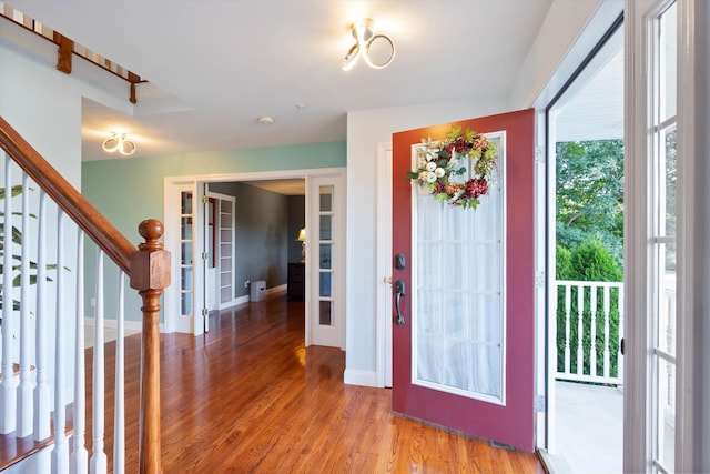 7 Partridge Cir, Salem, NH 03079 - foyer entrance with french doors, stairs, and light wood finished floors