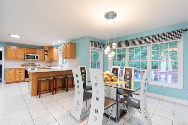 7 Partridge Cir, Salem, NH 03079 - dining area featuring light tile patterned flooring and baseboards