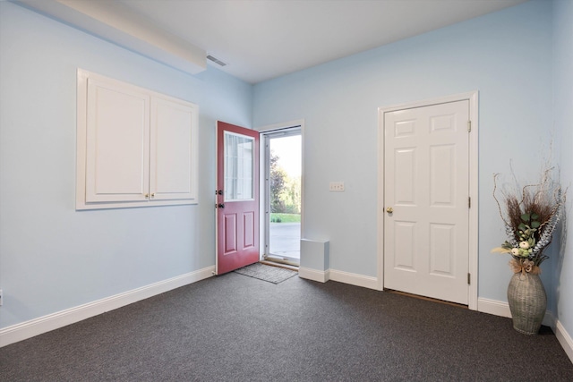 7 Partridge Cir, Salem, NH 03079 - entryway featuring dark carpet and baseboards