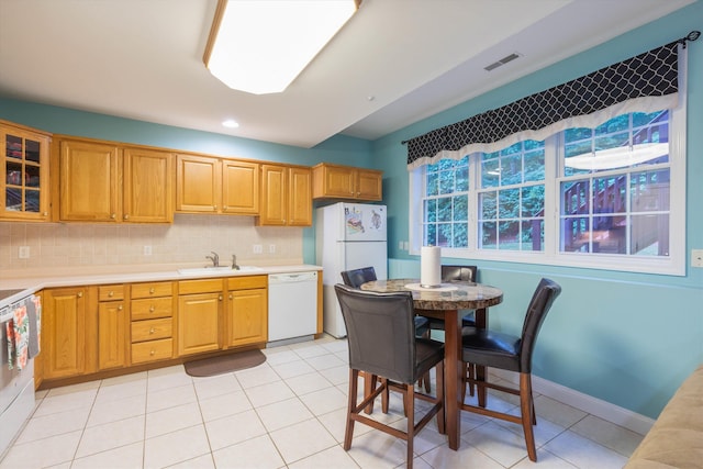 7 Partridge Cir, Salem, NH 03079 - kitchen with white appliances, light countertops, decorative backsplash, glass insert cabinets, and light tile patterned flooring