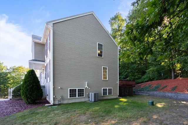 7 Partridge Cir, Salem, NH 03079 - view of side of property featuring a yard and a central AC unit