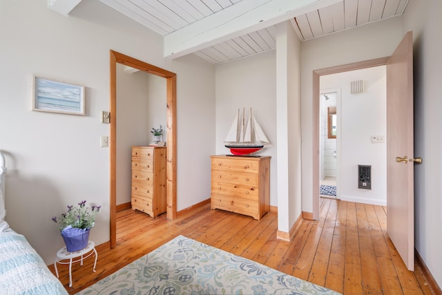 154 Cycad Ave, York, ME 03909 - bedroom with light wood finished floors and a wood ceiling with exposed beams