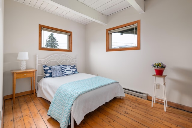 154 Cycad Ave, York, ME 03909 - bedroom with baseboard heating, light wood-style flooring, and a wood ceiling with exposed beams