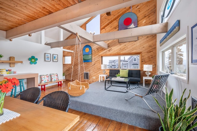 154 Cycad Ave, York, ME 03909 - living area with plenty of natural light, wood walls, hardwood / wood-style floors, high vaulted ceiling, and a wooden ceiling with exposed beams