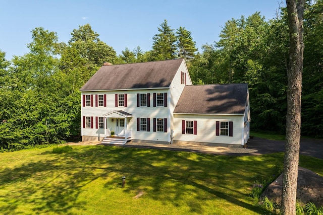 23 Stone Farm Rd, Barrington, NH 03825 - colonial house with a shingled roof, a front yard, and a chimney