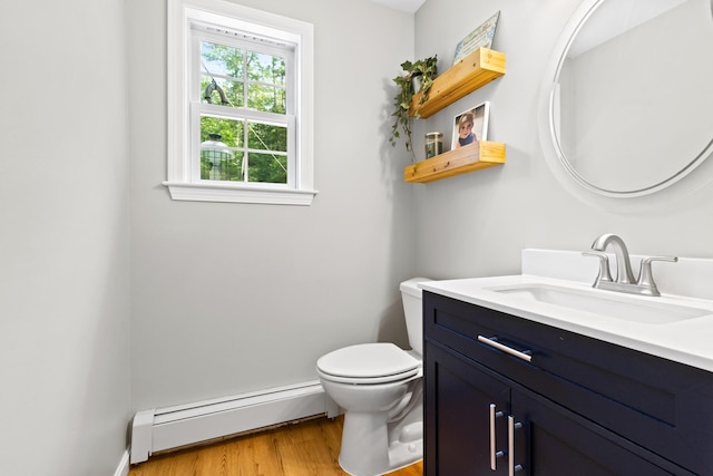 23 Stone Farm Rd, Barrington, NH 03825 - half bath featuring baseboard heating, vanity, and wood finished floors