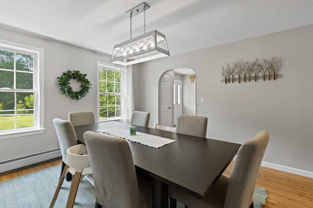 23 Stone Farm Rd, Barrington, NH 03825 - dining room featuring arched walkways, light wood-style floors, and baseboard heating