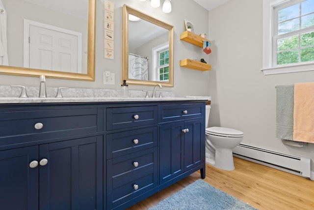 23 Stone Farm Rd, Barrington, NH 03825 - full bathroom featuring a baseboard radiator, double vanity, and wood finished floors