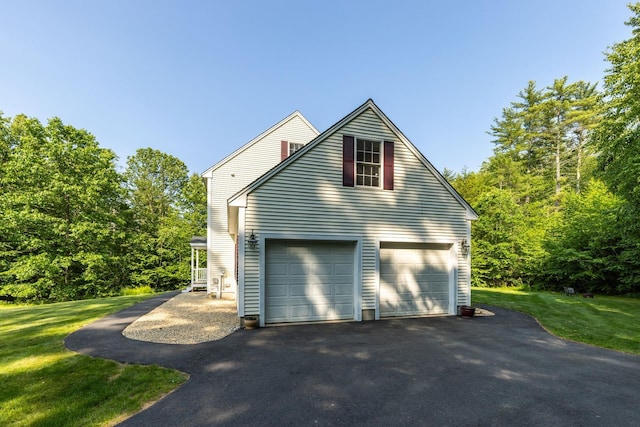 23 Stone Farm Rd, Barrington, NH 03825 - view of side of property with asphalt driveway, a garage, and a yard