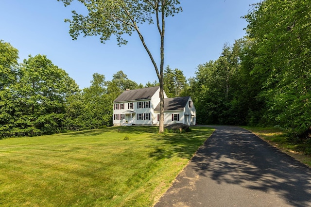 23 Stone Farm Rd, Barrington, NH 03825 - colonial-style house with a front yard, driveway, and a garage