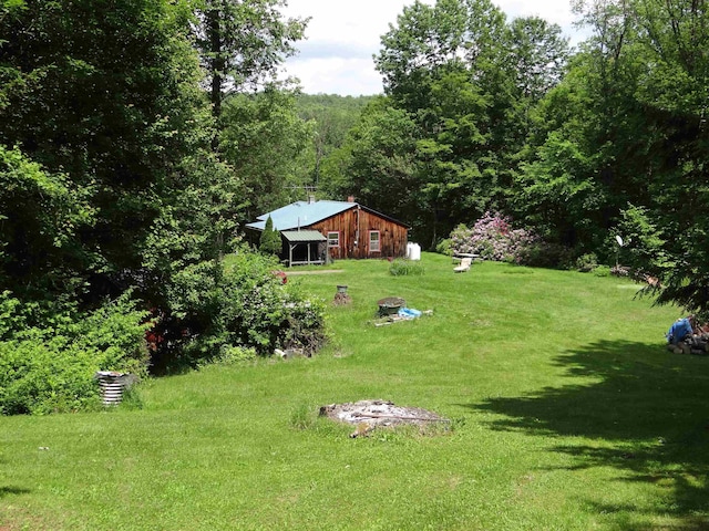 2505 County Rd, Windsor, VT 05089 - view of grassy yard with a view of trees, an outdoor structure, and a pole building
