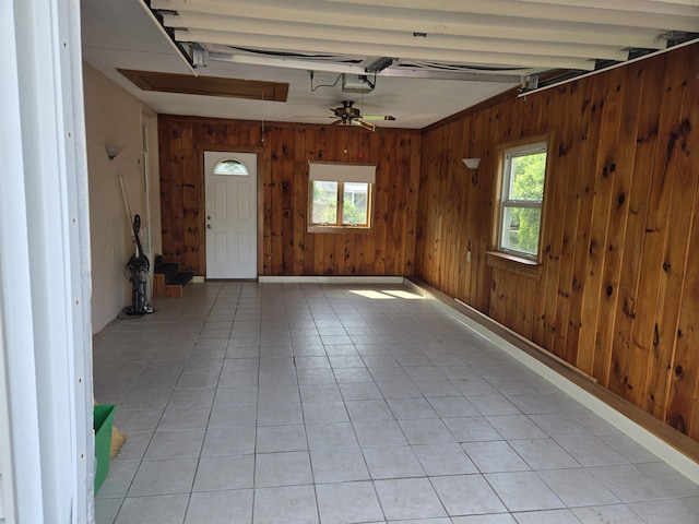 9 Mariette Dr, Portsmouth, NH 03801 - unfurnished room with wooden walls, light tile patterned flooring, and a ceiling fan