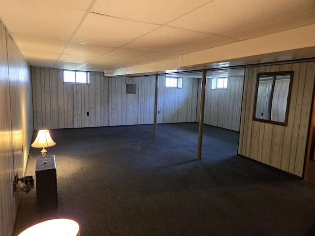 9 Mariette Dr, Portsmouth, NH 03801 - basement with dark carpet, wooden walls, and a drop ceiling