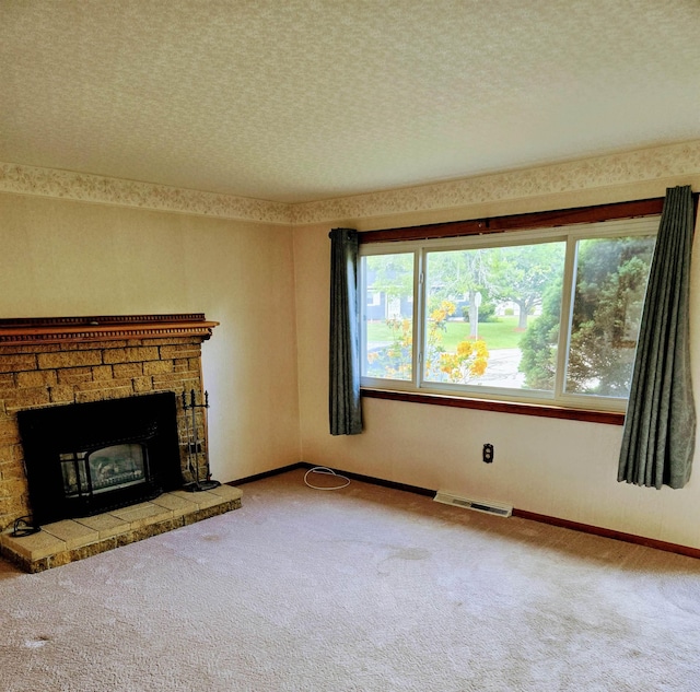 9 Mariette Dr, Portsmouth, NH 03801 - unfurnished living room featuring carpet flooring and a stone fireplace