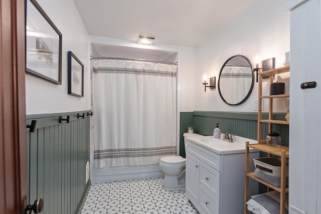 17 Brown Ave, Saint Albans City, VT 05478 - bathroom featuring tile patterned floors, a wainscoted wall, vanity, and shower / bath combo