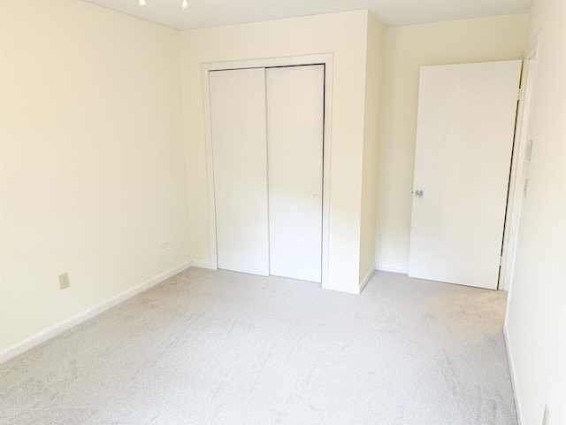 18 Gould Ave Unit 1, Meredith, NH 03253 - unfurnished bedroom with light carpet and a closet
