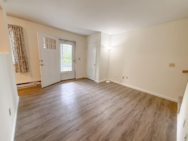 18 Gould Ave Unit 1, Meredith, NH 03253 - foyer featuring a baseboard heating unit and wood finished floors