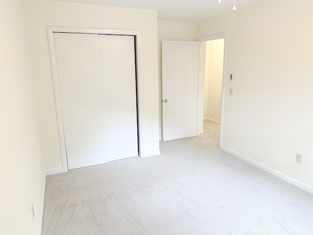 18 Gould Ave Unit 1, Meredith, NH 03253 - unfurnished bedroom featuring light colored carpet and a closet