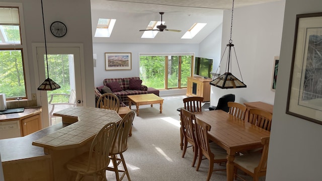 248 Club Sugarbush Ext Unit 18, Warren, VT 05674 - dining room featuring a skylight, lofted ceiling, light carpet, and healthy amount of natural light