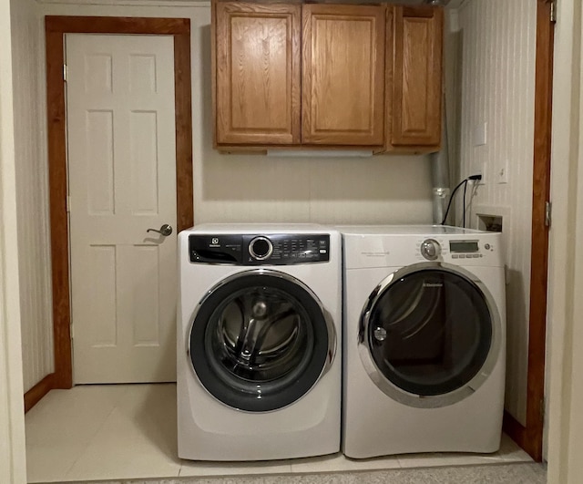 248 Club Sugarbush Ext Unit 18, Warren, VT 05674 - washroom with cabinet space, independent washer and dryer, and light tile patterned floors